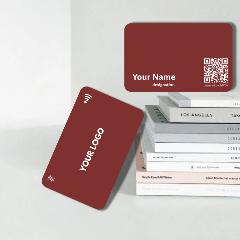Red business cards with customizable text on a white surface