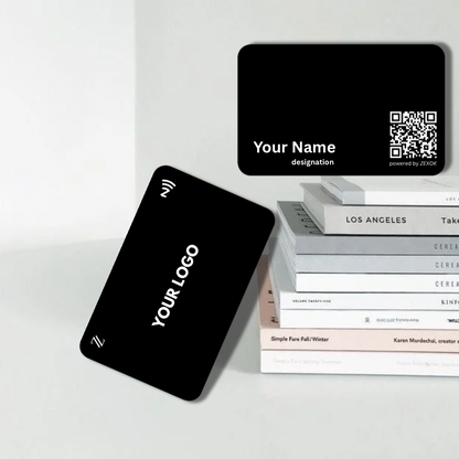 Black business cards with customizable text on a white surface