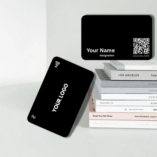 Black business cards with customizable text on a white surface