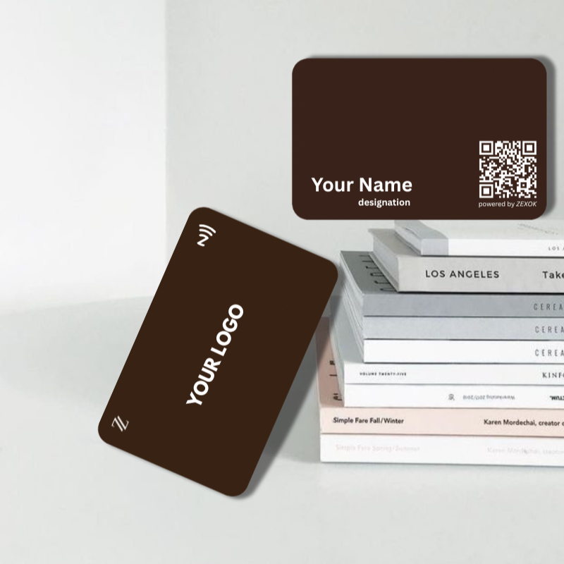 Two brown business cards with placeholder text and a QR code, one with a logo, on a white surface.